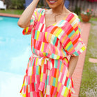 Eyes On You Coral & Yellow Geo Abstract Surplice Woven Romper