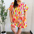 Eyes On You Coral & Yellow Geo Abstract Surplice Woven Romper