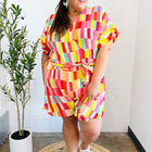 Eyes On You Coral & Yellow Geo Abstract Surplice Woven Romper