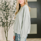 Petal Poise Floral Applique Pullover in Ivy
