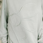 Petal Poise Floral Applique Pullover in Ivy